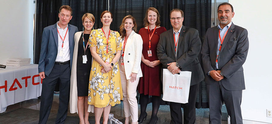 舱口的同事一起庆祝H。G. Acres Seminar. From left: Jim Law, Chelsie Klassen, Beth Buckmaster, Kathleen Wood, Kathleen Vukovics, Jim Sarvinis, and Adel Muna.